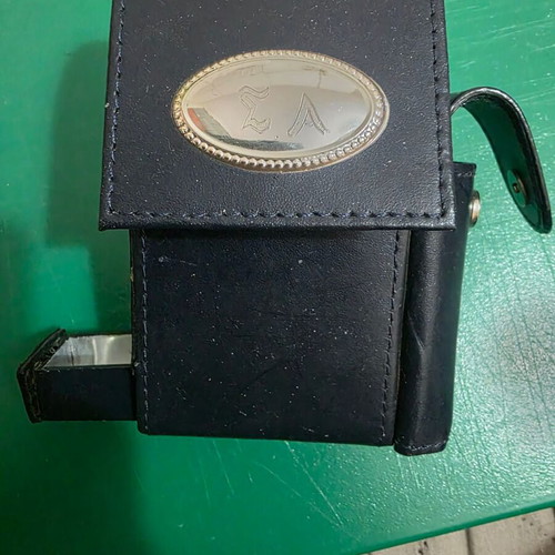 Leather tobacco case with silver frame and compartments