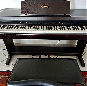 Ηλεκτρικό πιάνο Yamaha clavinova clp-820 με το κάθισμα του και με βιβλία εκμάθησης.