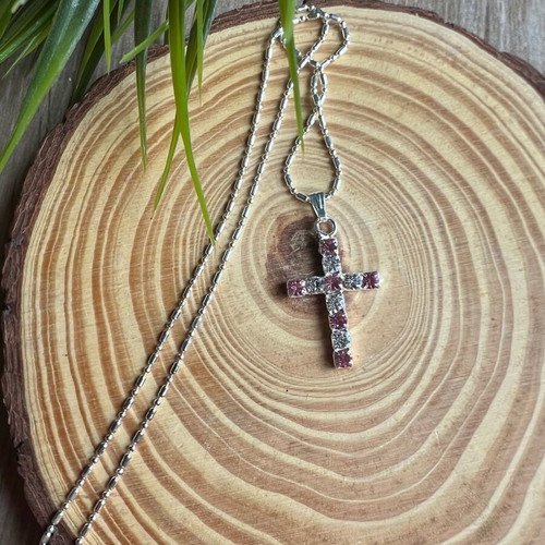 Cross like new with white and pink details