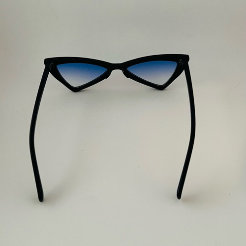Glasses with blue triangular lens used, black frame