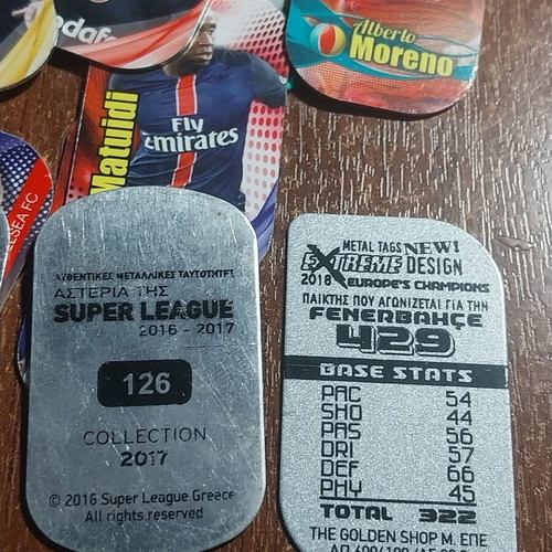 Metal tags with football players, pack of 45, like new