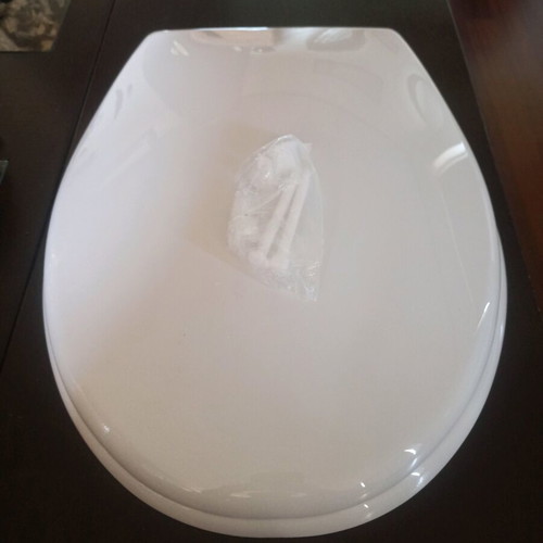 Plastic toilet seat new with screws
