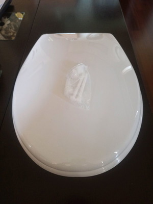 Plastic toilet seat new with screws