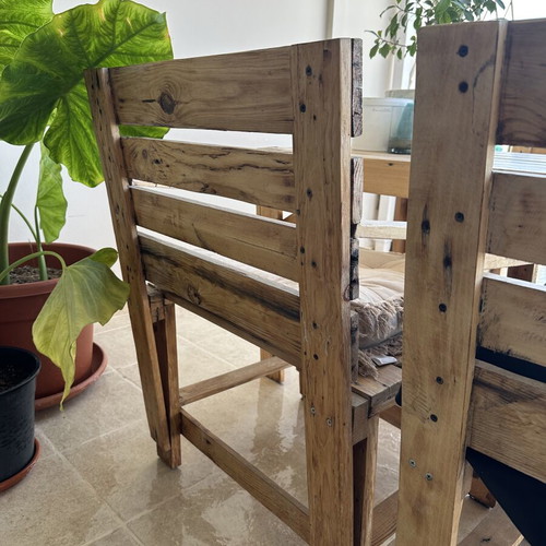 Handmade wooden table set with chairs and bench used