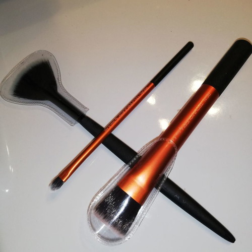 Real Techniques and Avon makeup brush set used