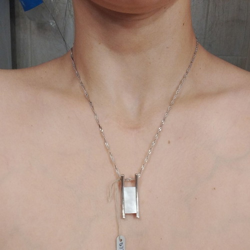 Silver women's necklace with minimal geometric pendant