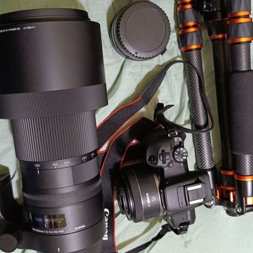 Canon R-100 camera like new with tripod and three lenses