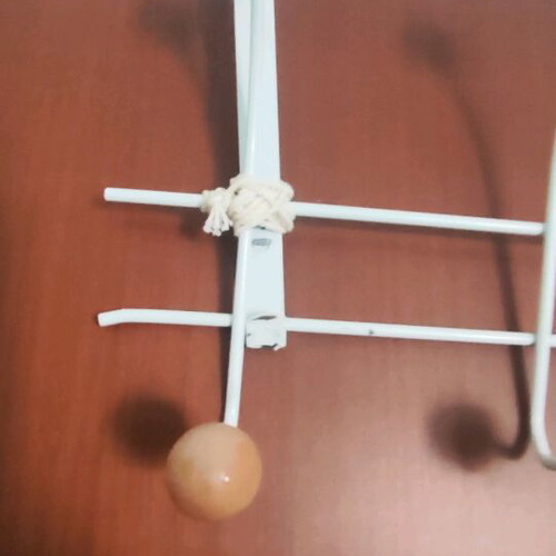 Metal coat rack used white with wooden ends and 10 hooks