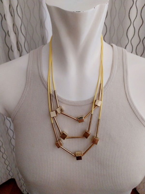 Faux bizoux necklace like new with cubes and yellow cord