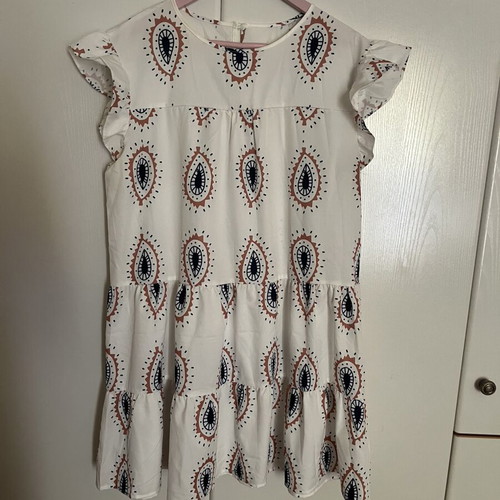 Dress with eye motifs and ruffles on sleeves and hem one size new