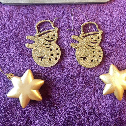 Set of gold Christmas decorations, stars and snowmen