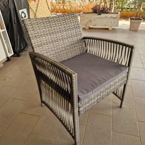 Garden sofa set with cushions and table