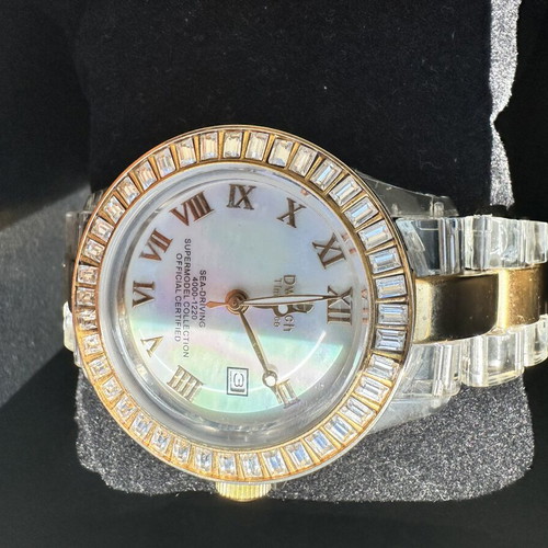 Watch with iridescent crystals like new, zircon and gold