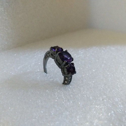 Ring with Purple Crystals and Black Plated Finish like new