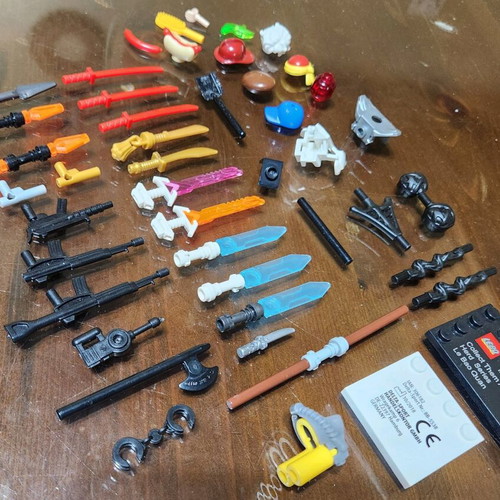 Lego accessory pack used with swords, weapons, hats and armor