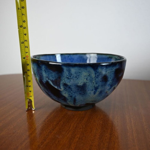 Ceramic bowl used with blue glazed surface