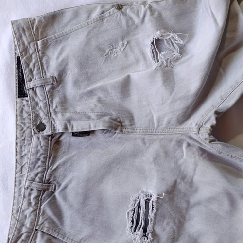 Vagrancy gray jeans with knee rips and frayed hems, size 32