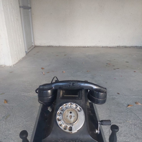 Antique telephone used, black corded