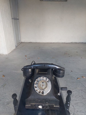 Antique telephone used, black corded