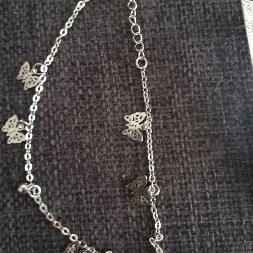Various silver jewelry including earrings, body chain, rings, and necklace