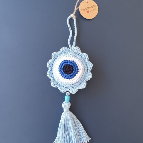 Handmade baby blue crocheted eye decoration