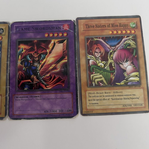 Yu-Gi-Oh! cards set with Flaming Swordsman, Battle Ox, Gearfried the Iron Knight, Three Sisters of Miss Harpy