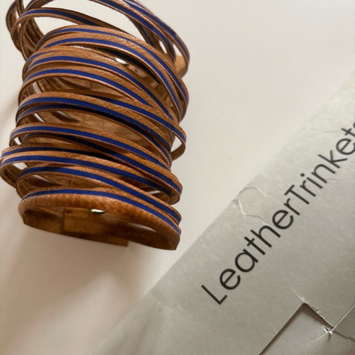 Leather bracelet used brown with blue details