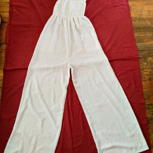 One-piece jumpsuit with straps used, size medium, cotton