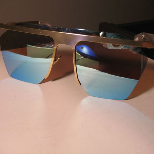 Stylish women's sunglasses with blue mirrored lenses, gold frame