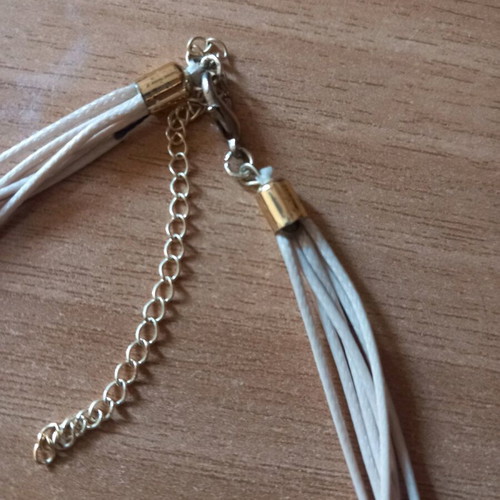Star Necklace with Beige Cord and Multiple Layers Like New