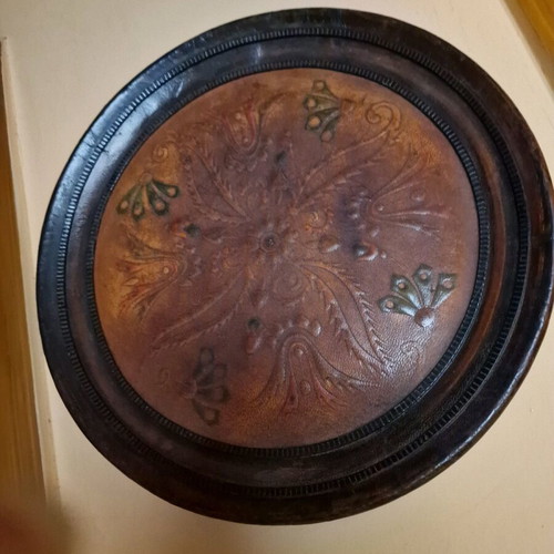Vintage wooden wall decoration with leather center