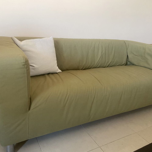 Two-seater sofa with khaki cover