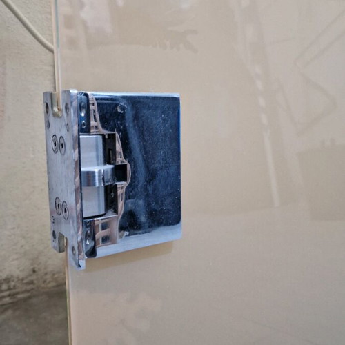Glass door used with metal hinges and glass knob