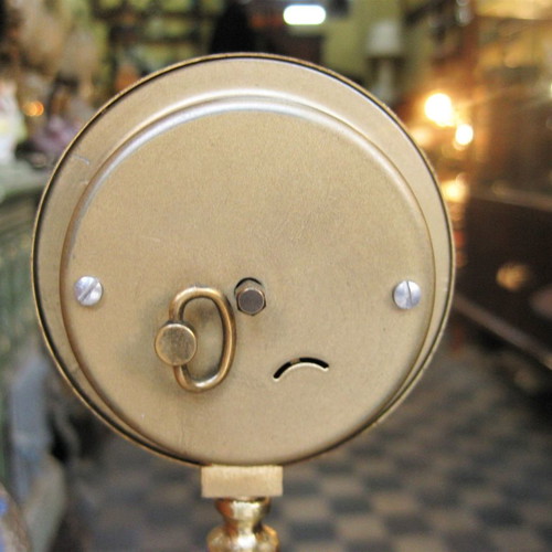 Brass tabletop clock used with decorative base