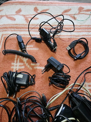 Pack of used chargers and cables for home and car