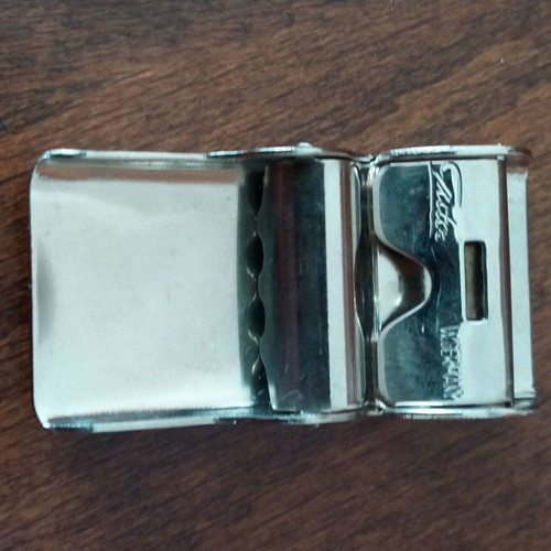 Collectible Gutos steel belt buckle used, shiny silver, men's