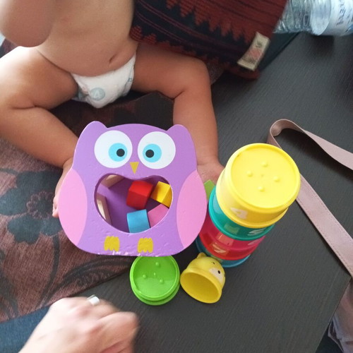 Toy set used with stacking cups and wooden owl shape sorter