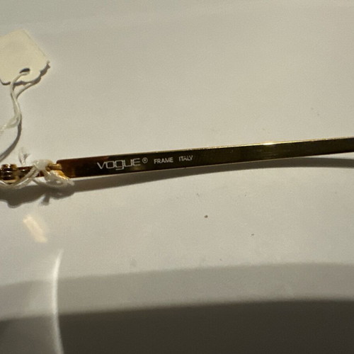 Vintage Vogue sunglasses with gold and black details, new