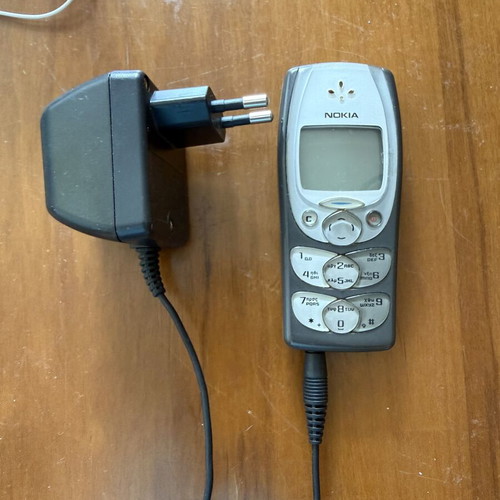 Nokia 2300 mobile phone with charger and headphones