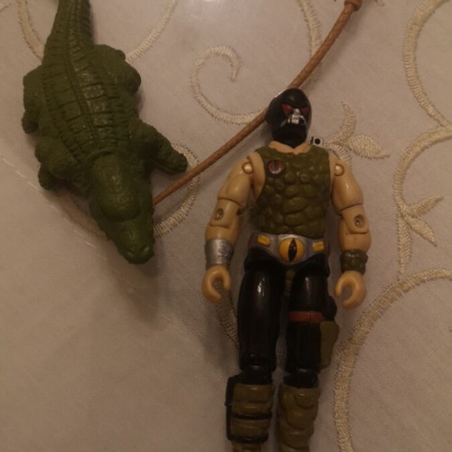 G.I. Joe action figure with alligator, whip and animal muzzle