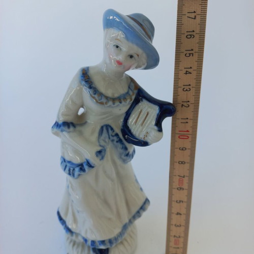 Porcelain figurine with girl musician like new