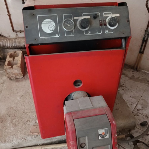 Complete oil heating system used with boiler burner and tank