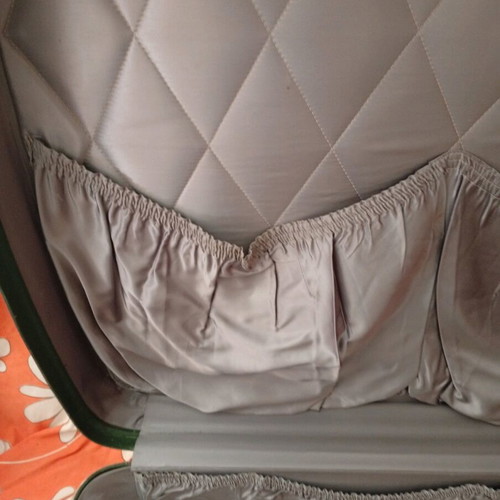 Vintage suitcase used with dark green color and quilted lining