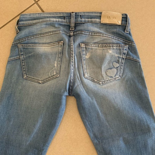 Blue skinny jeans like new with hearts, size XS
