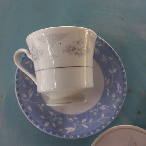 Set of 7 assorted cups and saucers