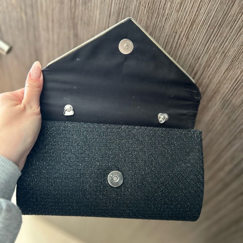 Black clutch handbag like new with embossed texture