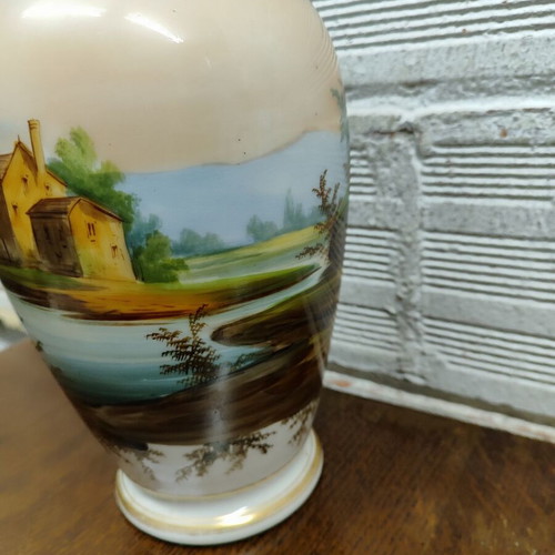 Old porcelain vase used, hand-painted with romantic scene