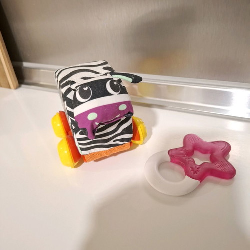 Luna fabric animal with wheels and teether star like new