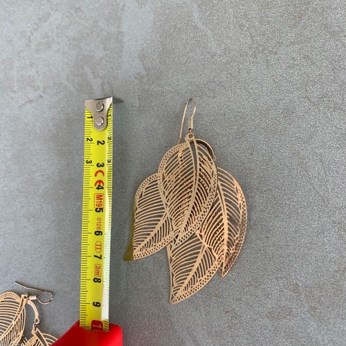 Accessorize metal gold feather earrings like new