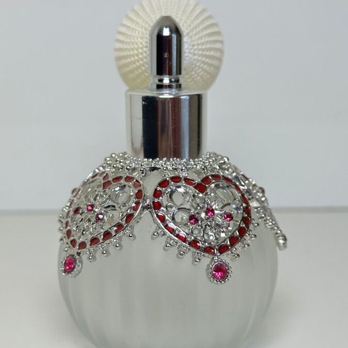 Vintage perfume bottle with pump, decorative hearts and crystals